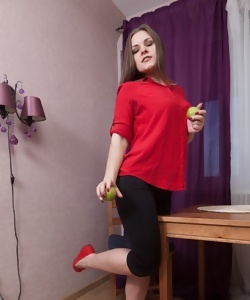 Housewife eats some fruits before showing off hairy pussy