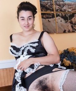 Uniform housemaid exposes extremely hairy vagina in kitchen