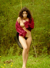 Slim wife with wavy hair and hairy pussy stays naked near container